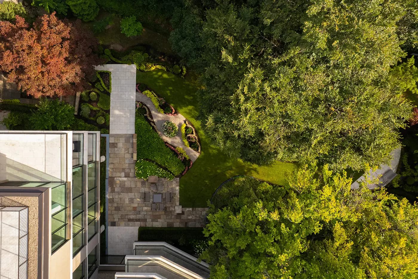 The entry — Algonquin limestone and a heritage tree kept in place.