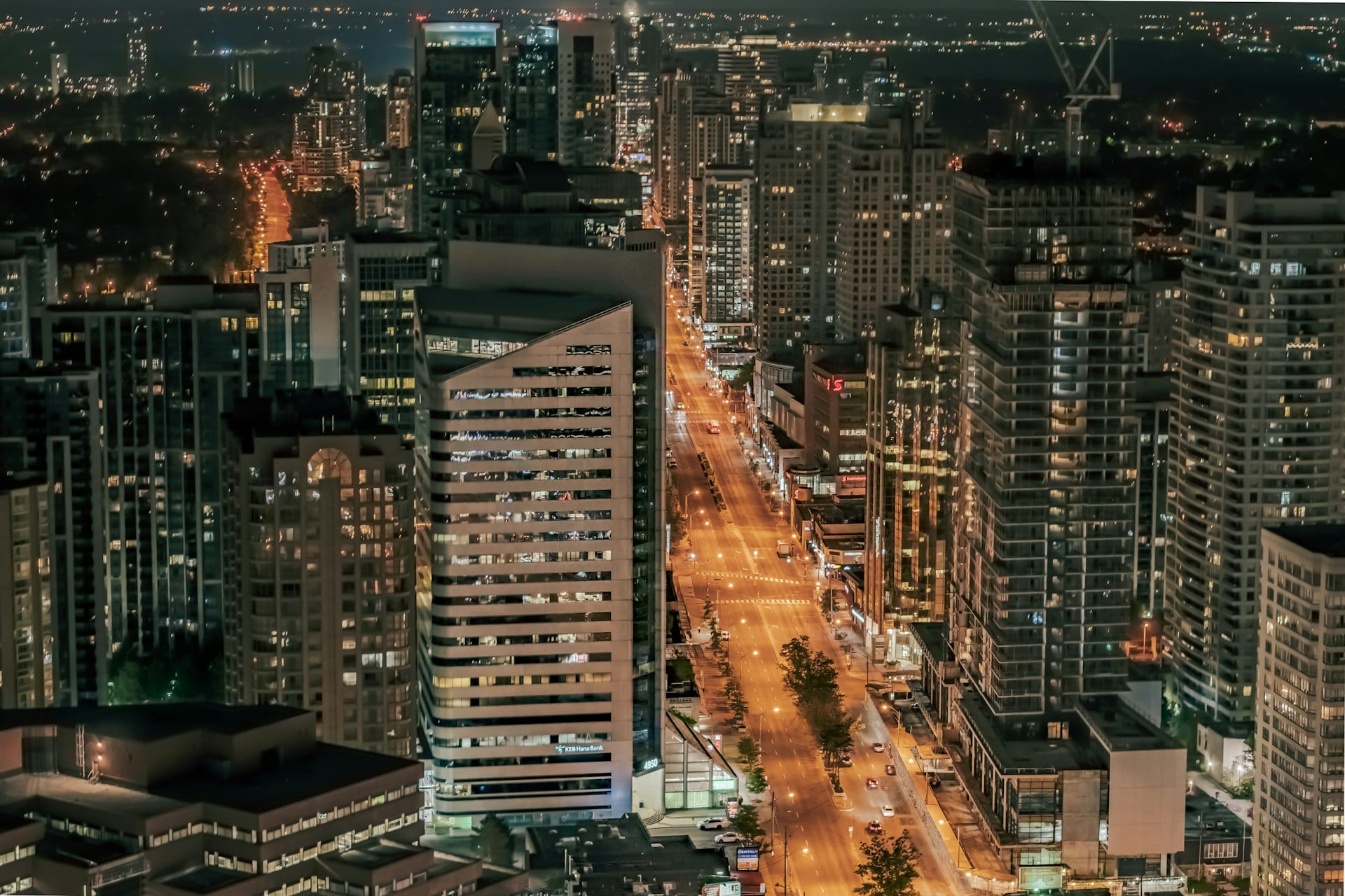 The Yonge Street high-rise corridor at night, towers lining the avenue.